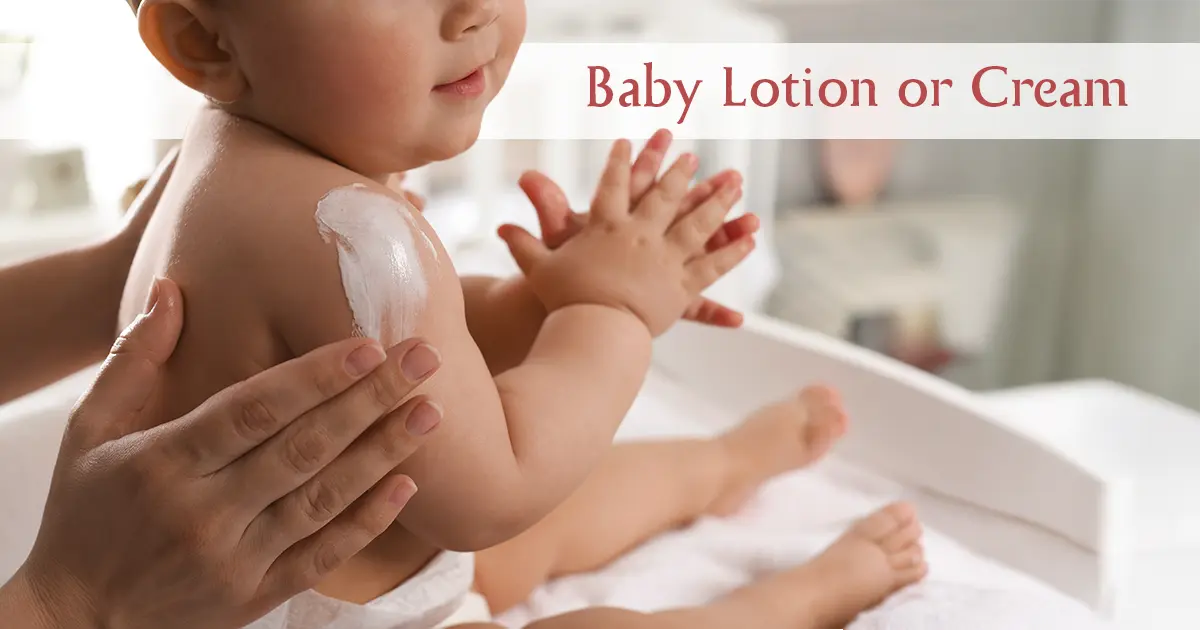 A mother applying cream to her baby