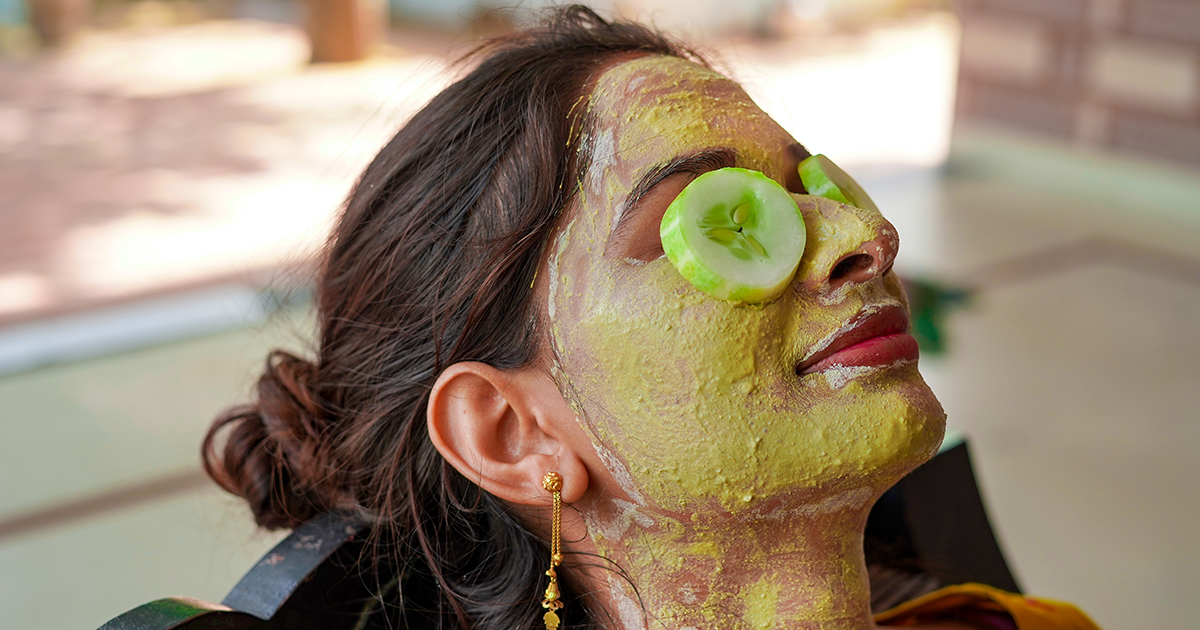 A woman applied besan, haldi, and cucumber on her face