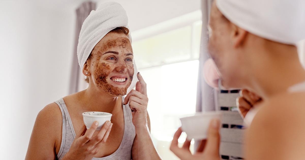 A woman applying coffee and milk face pack