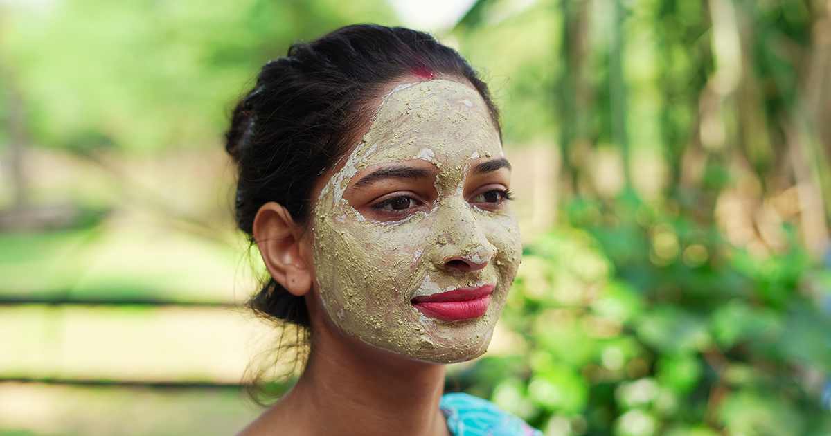 A woman with a Multani mitti on her face