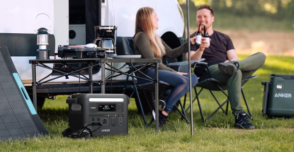 Couple outside camper van with Anker F2600 Solar Generator
