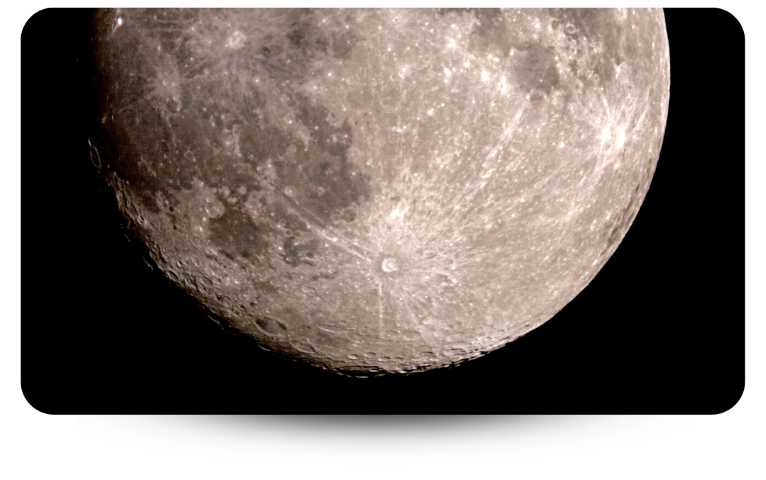 The moon with blackness behind it showing details of the moon's surface