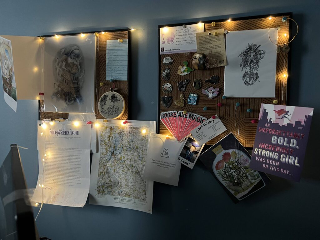 A bulletin board with pictures and lights on it.