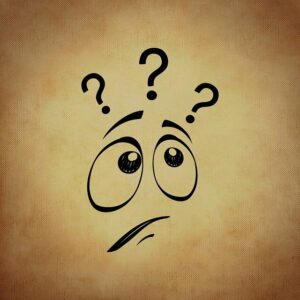 Cartoon face with three question marks above its head.