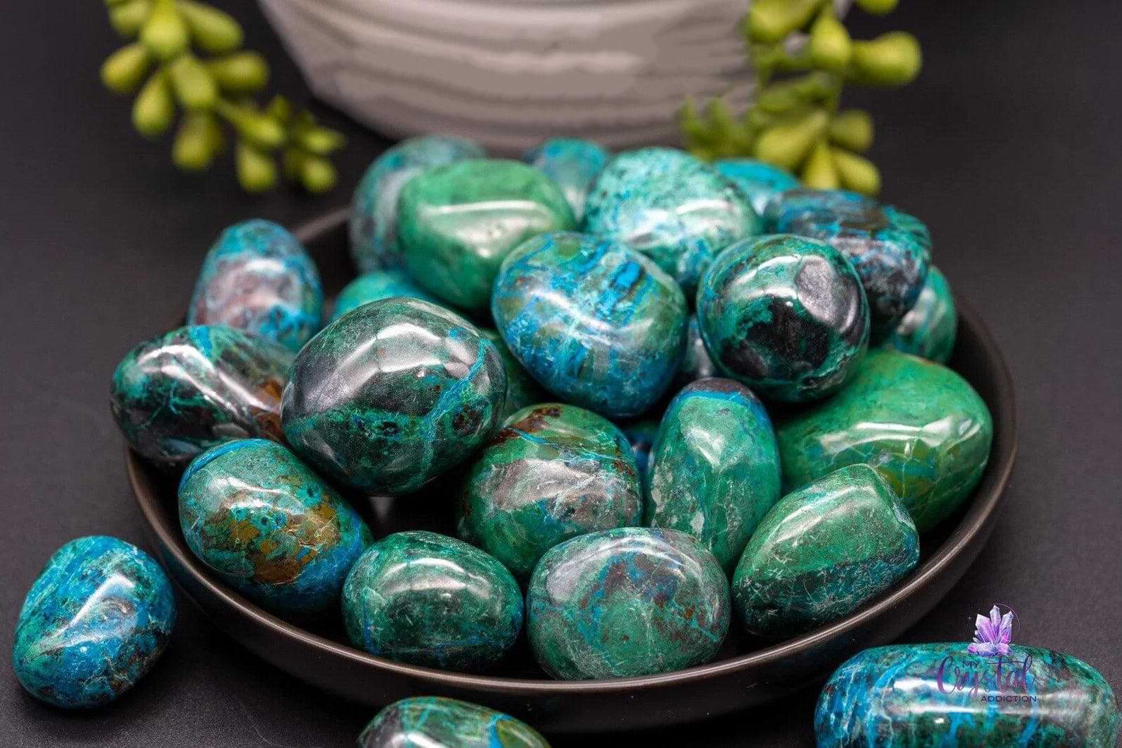 Polished blue-green Chrysocolla stones in a black dish, grounding Gemini’s mental buzz with calming, heart-centered energy.