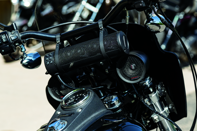 Satin Black Kuryakyn Road Thunder Plus Sound Bar mounted on handlebars