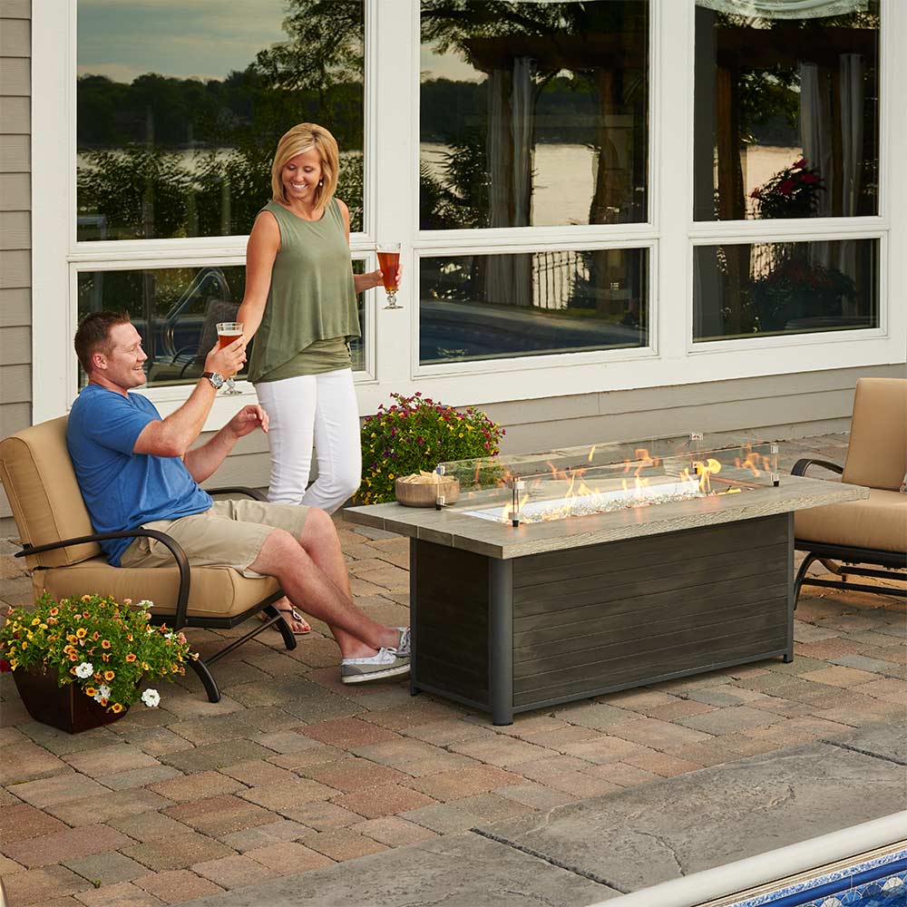 Cedar Ridge propane fire pit table in an outdoor patio setting