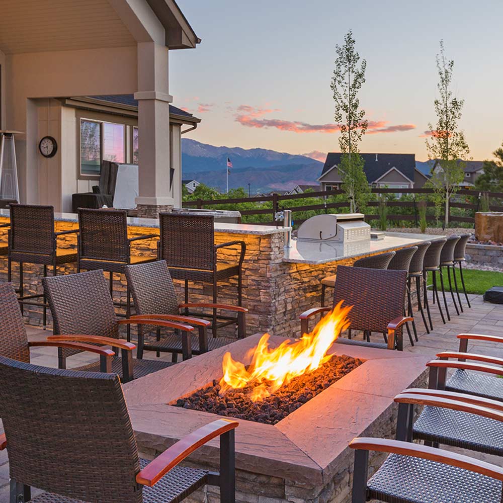 Outdoor kitchen with rectangular fire feature