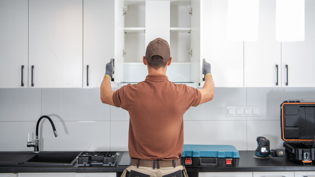 A carpenter fixing in kitchen