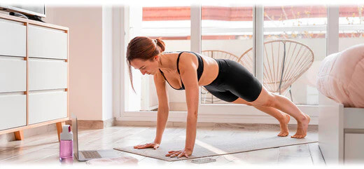 An image featuring a person exercising at home. The image suggests the topic of home-based workouts and fitness routines