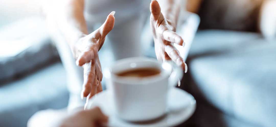 lady reaching for Caffeine