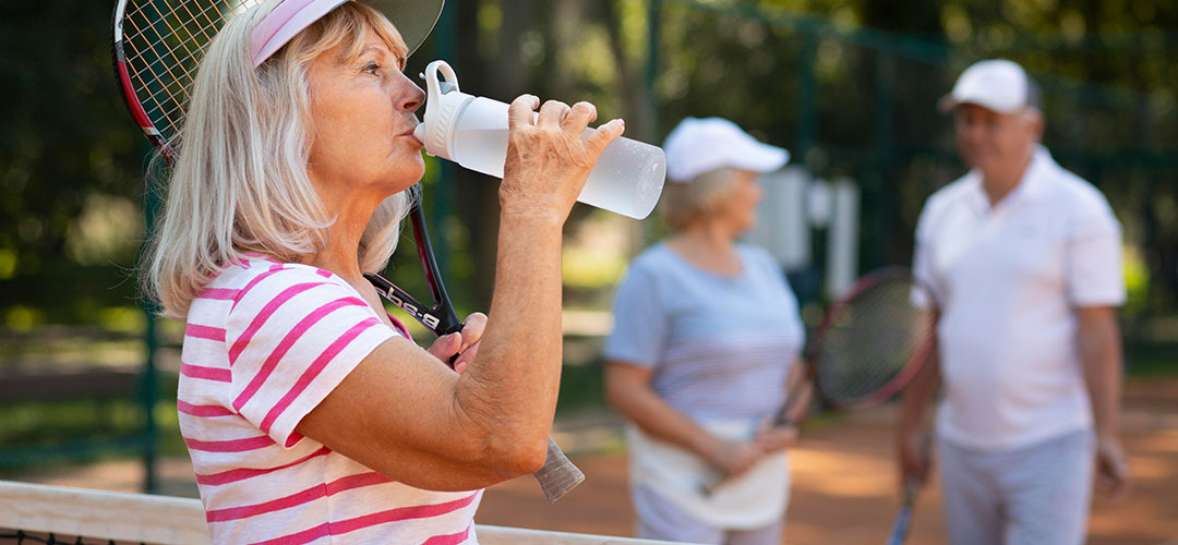 drinking water while playing tennis