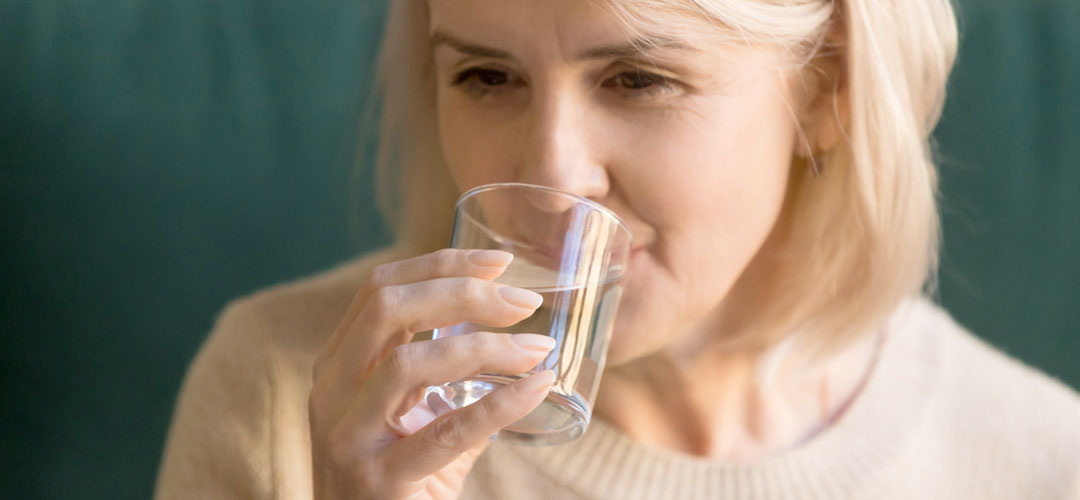 lady drink a glass of water