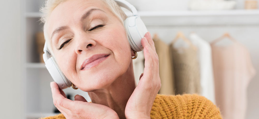 middleage lady listening to her playlist happy and relaxed