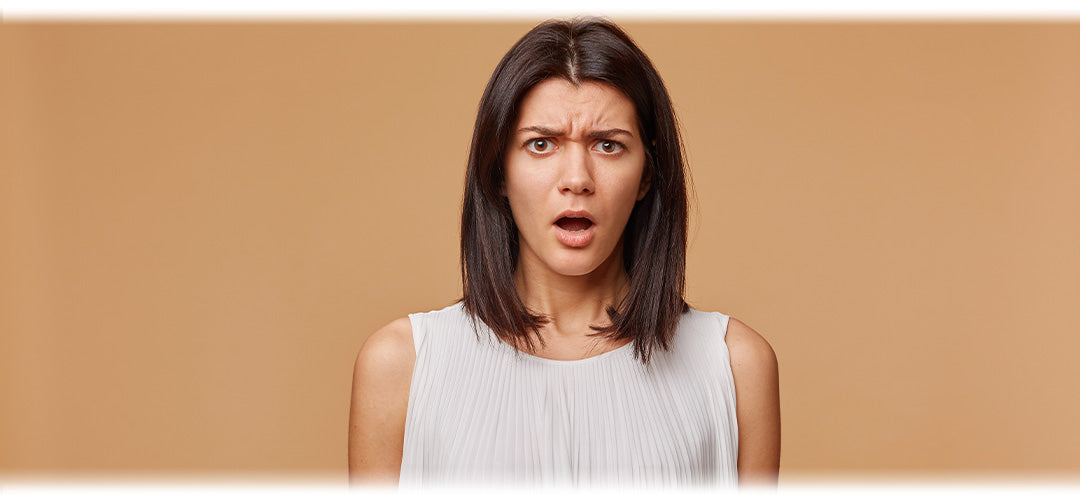A woman with a shocked expression on her face