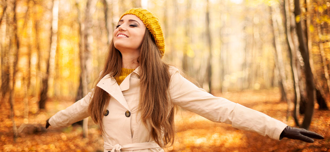 young-woman-enjoying-nature-autumn