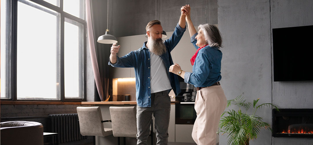 couple dancing to music in the living room