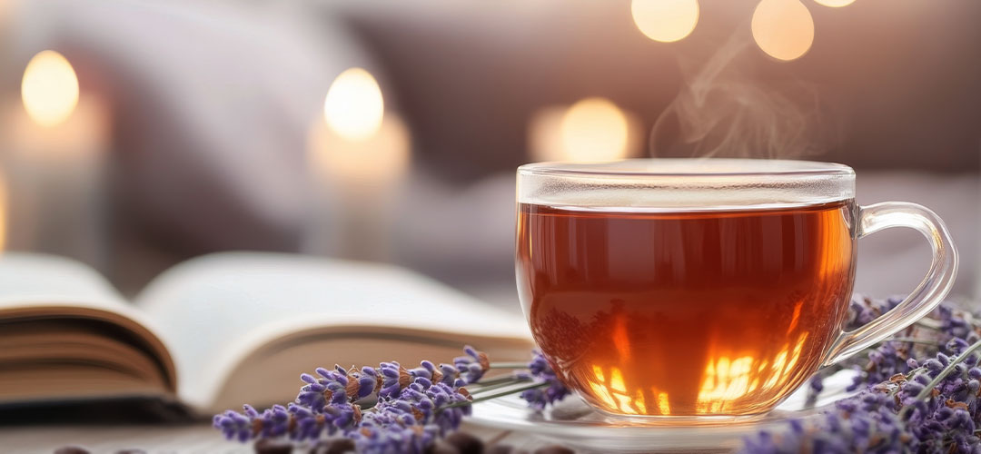 a-cup-of-tea-and-lavender-flowers-on-a-wooden-table
