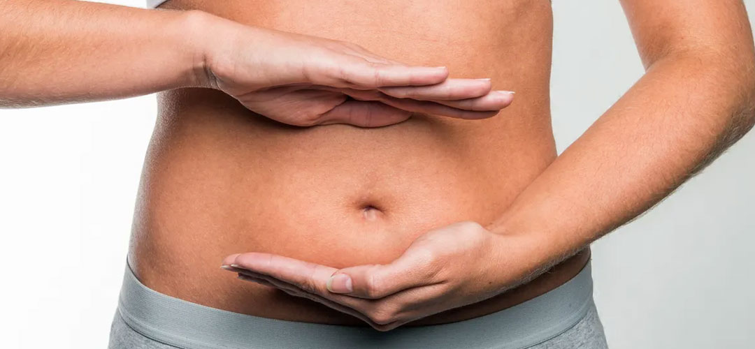 hands circling tummy indicating healthy digestion