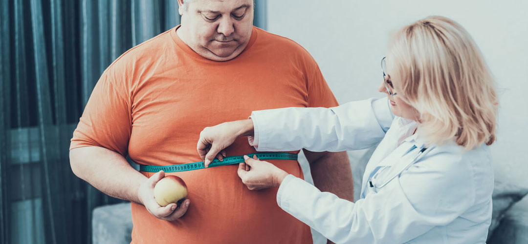 male in doctors getting weighed