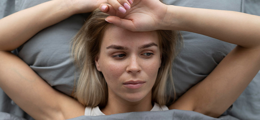 close-up-sad-woman-bed