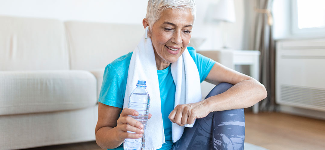 middle age lady work out and drinking water