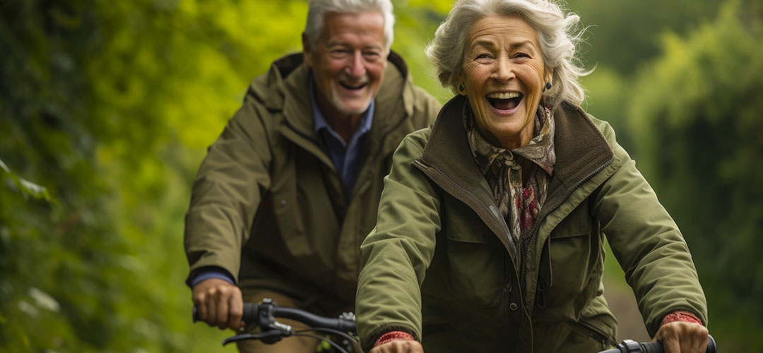 older-couple-riding-their-bikes-together-outdoors