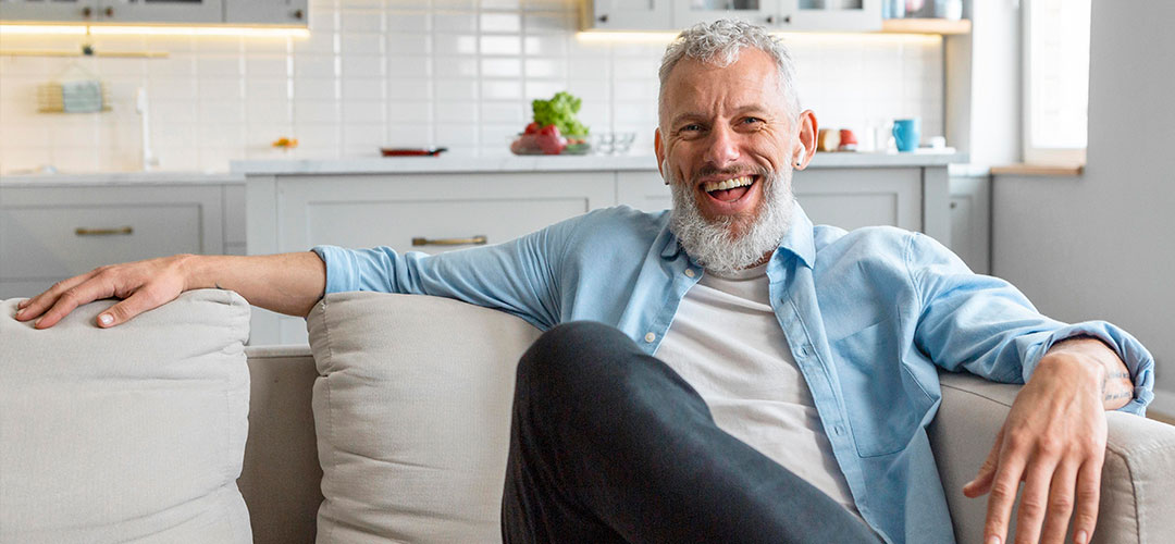 medium-shot-happy-man-couch