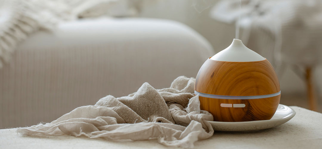  Aroma diffuser releasing vapor in bedroom