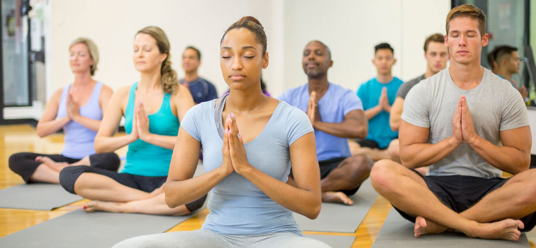 women meditating in a yoga class