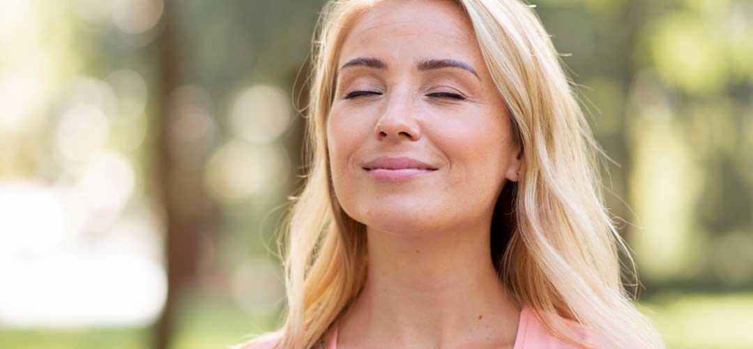 40 plus lady relaxing feeling of wellbeing