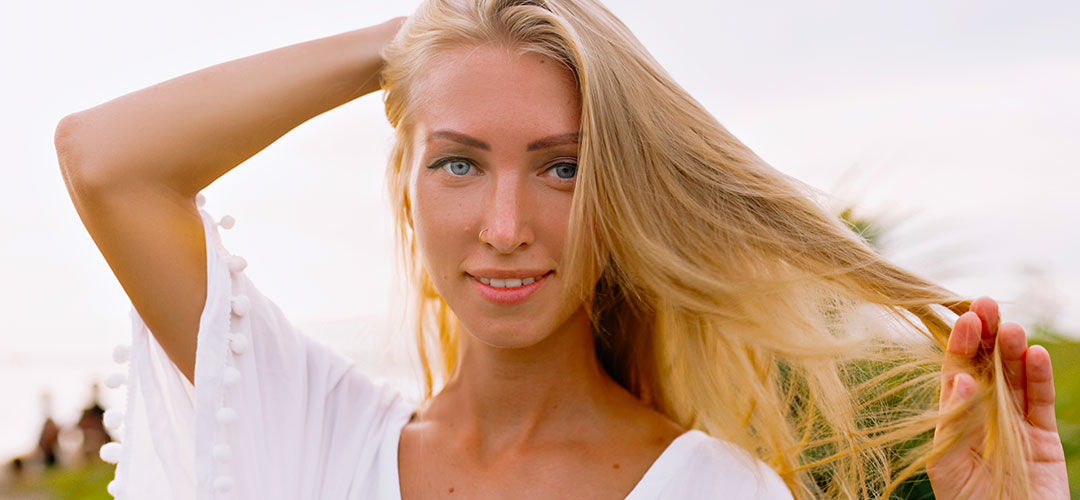 female enjoying hair strong healthy hair from the support from lily and loafs collagen