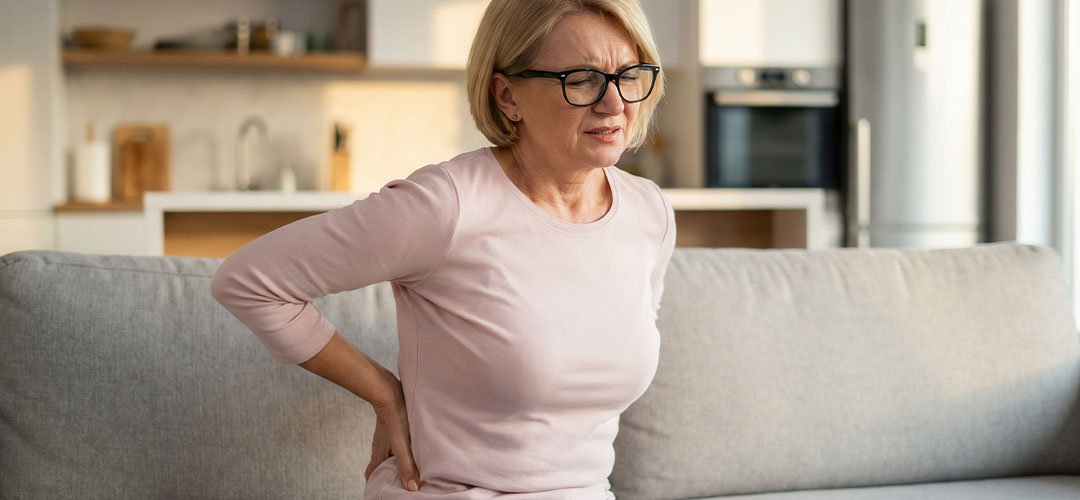 mature-woman-experiencing-lower-back-pain-while-sitting