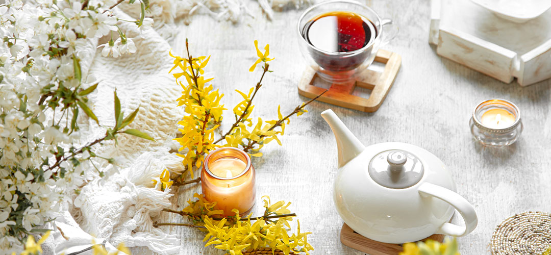 spring-still-life-with-cup-tea-flowers-light-background-blooming-cozy-house
