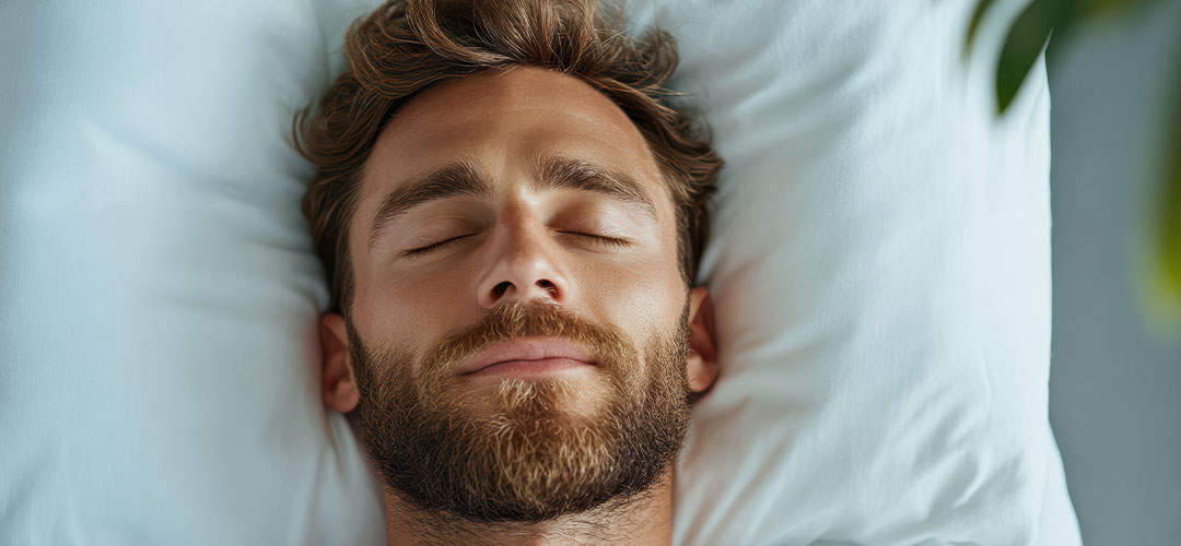 a-man-with-a-beard-and-white-shirt-is-sleeping