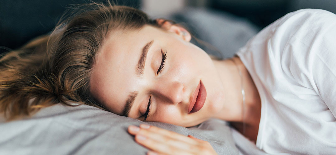 female asleep in bed
