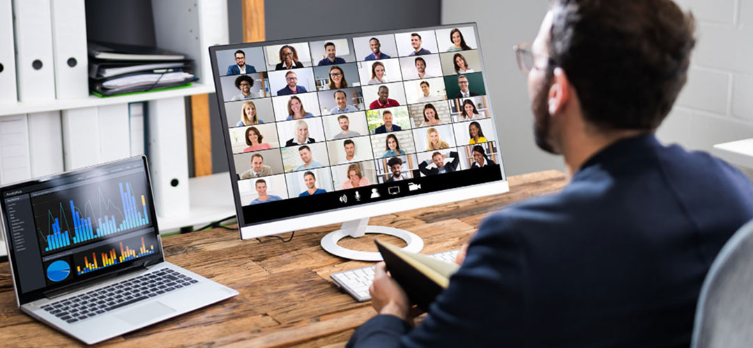 male attending meeting with others online