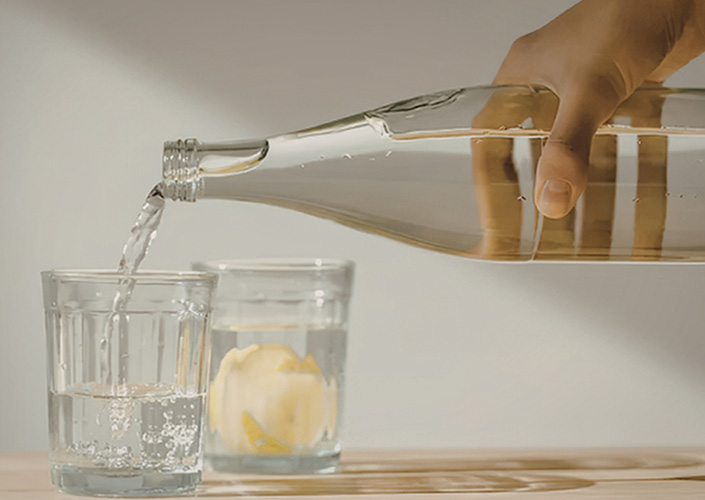 pouring water into glass