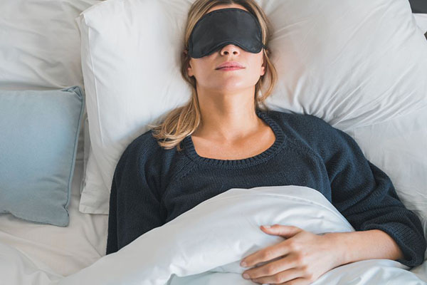 sleeping woman with mask