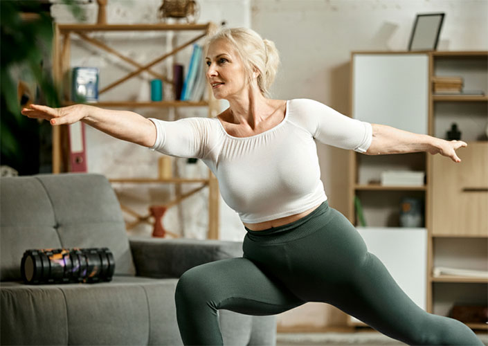 Woman practicing yoga for stress relief and menopause weight management