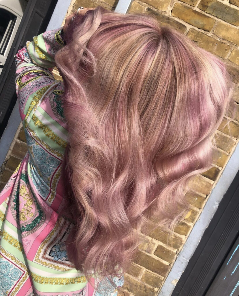 womans pink hair shown from the back