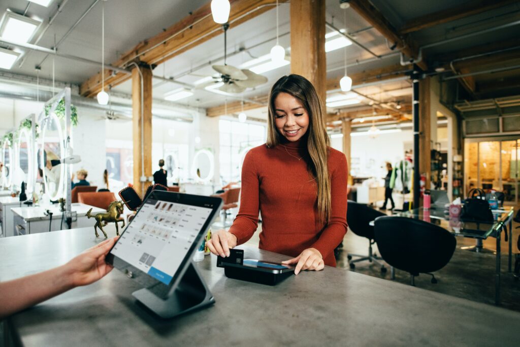 Woman in salon receiving loyalty scheme