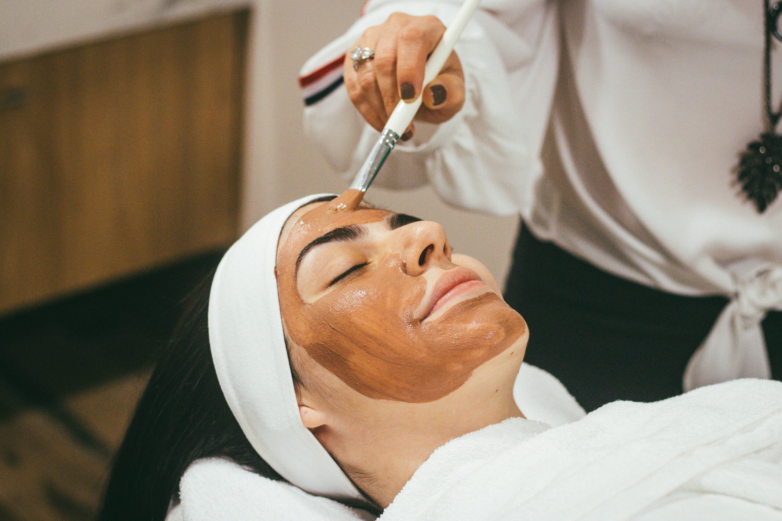 woman has a face mask painted onto her skin