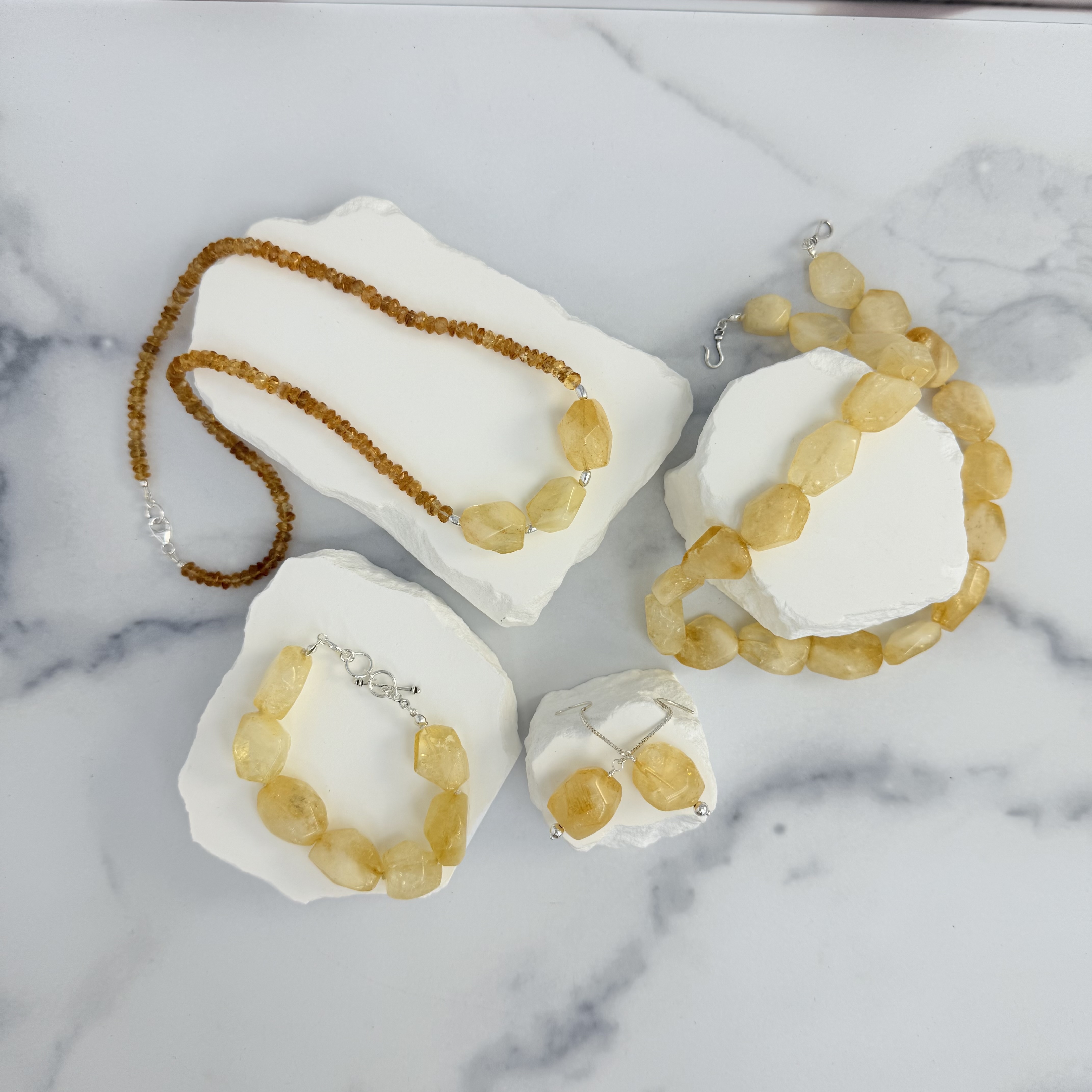 Two citrine necklaces, one citrine bracelet and one pair citrine earrings