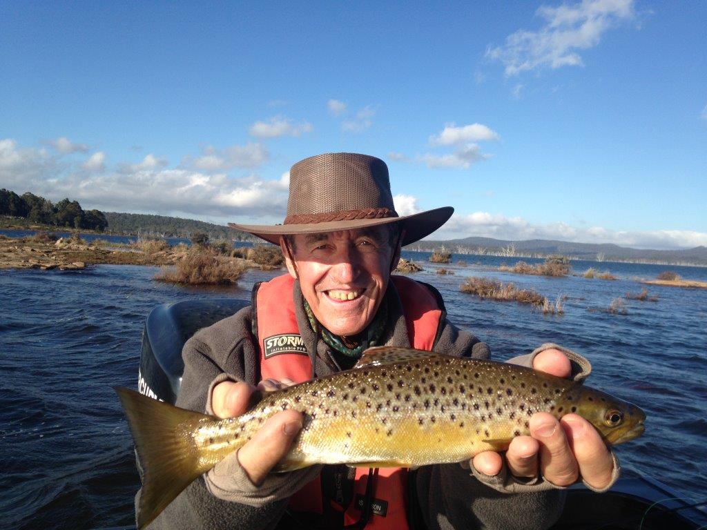Arthurs Lake is still high, providing good fishing over submerged kerosene bushes. Euan Leckie holds a good fish.