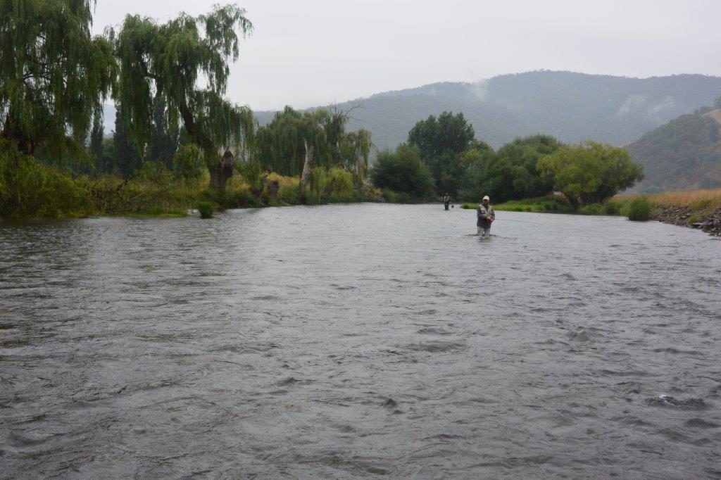 Mark and Nick fishing the Indi as the rain increases.