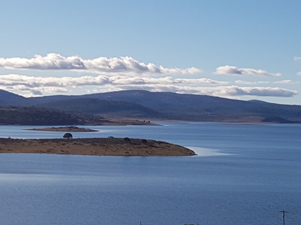 Tantangara Reservoir with a glassy shoreline