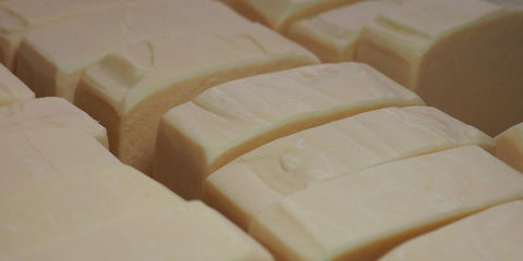 group of creamy goats milk soap