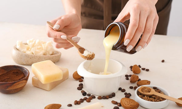 person mixing soap ingredients into container