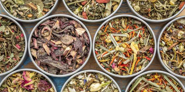 the smelly panda soap company round tins of herbal blends sitting on a table